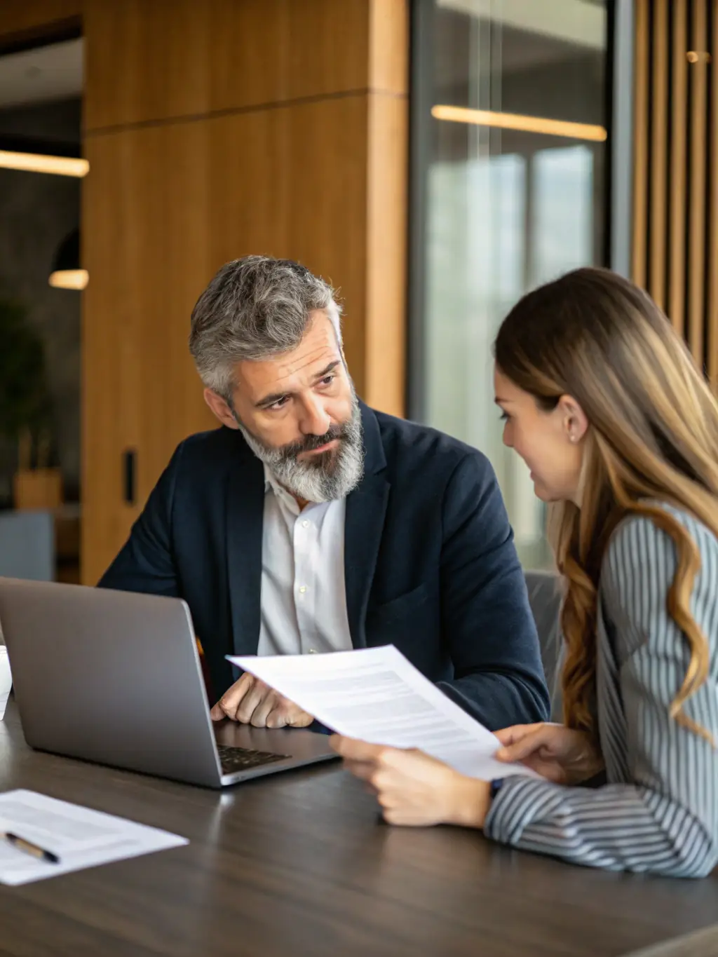 A professional business coach is presenting a detailed financial report to a small business owner, highlighting key performance indicators and areas for improvement.